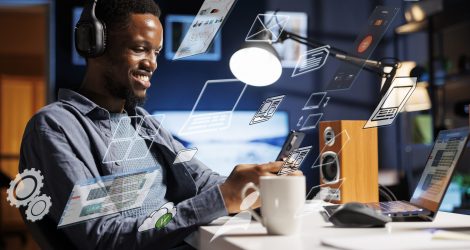 Business person using laptop multitasking to finish daily startup tasks, internet of things concept. Uses artificial intelligence optimization system for productivity, access pc smart things menu.